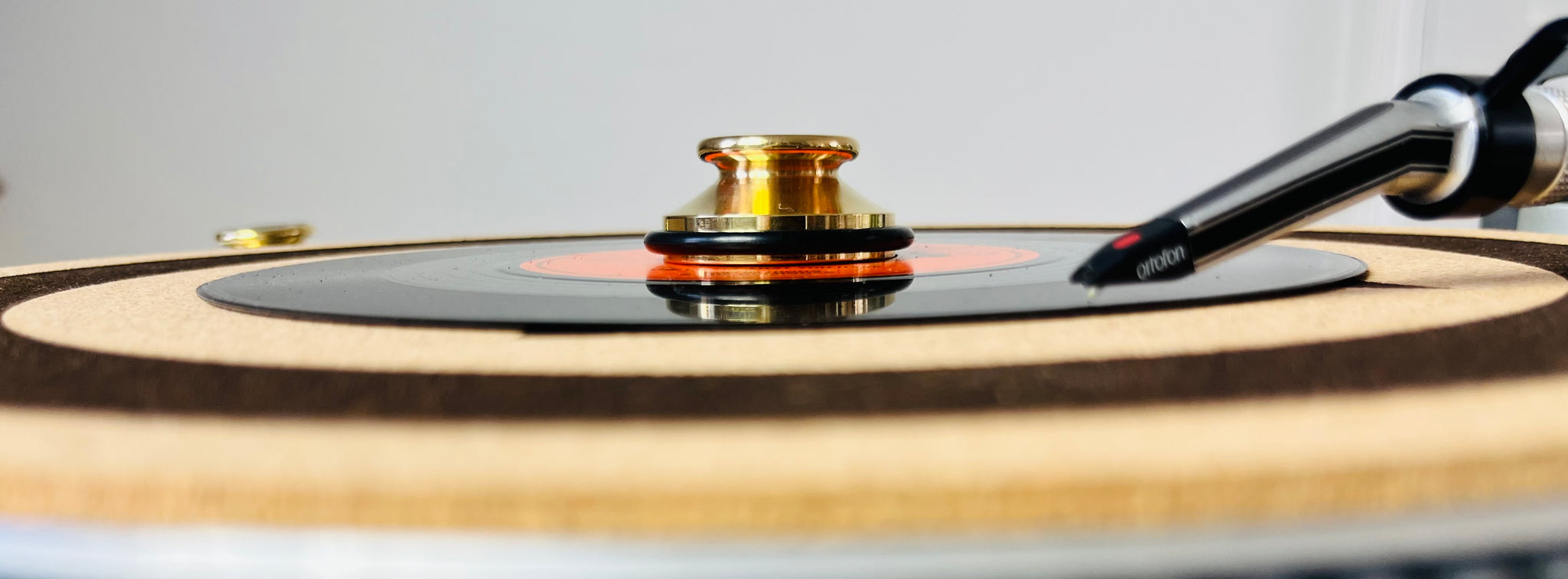 Brass Record Adapter on turntable, side view