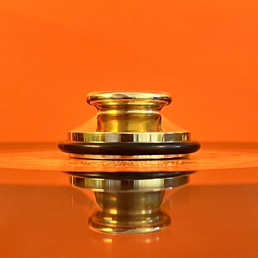 Trojan Brass Record adapter (side view) orange background